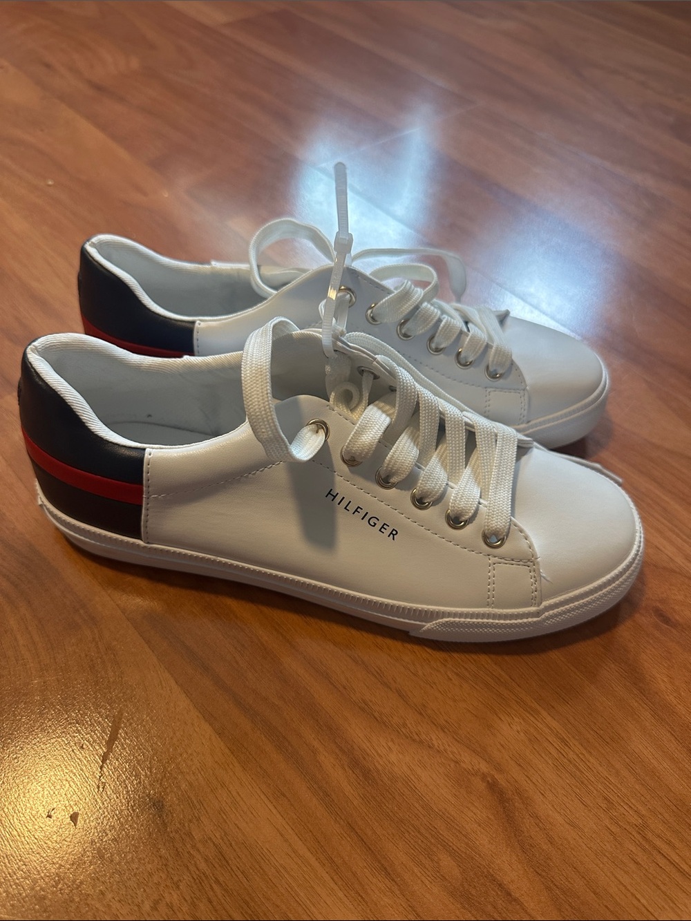 Women’sTommy Hilfiger White Leather Low-Top Sneakers with Navy & Red Heel Stripe